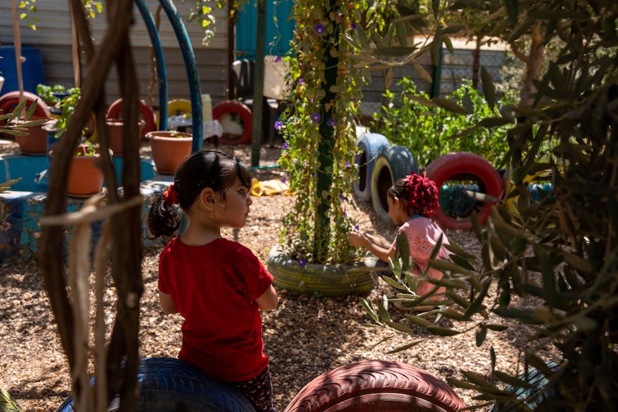 Two children in a garden.
